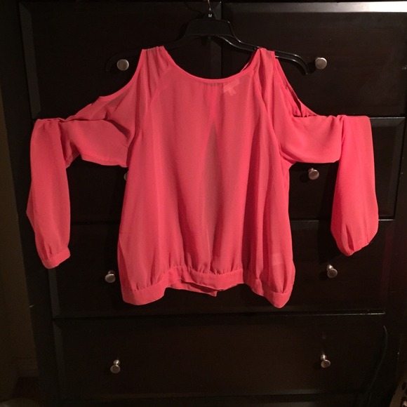 A chic pink/orange see through shirt.