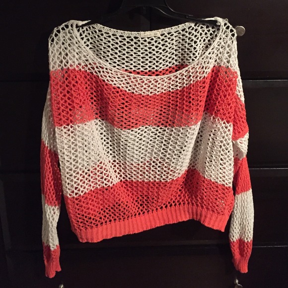 Pink and white striped sweater.