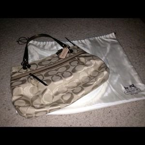 Brand new never been used gold coach bag