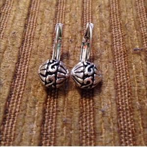 Two pair of silver ball earrings.
