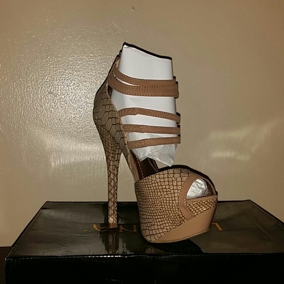 Tan stiletto pumps.