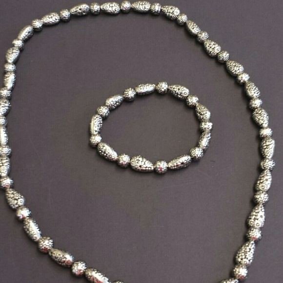 Two-piece. Silver. Beaded. Neckline