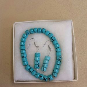 Two-piece. Earrings. And . bracelet