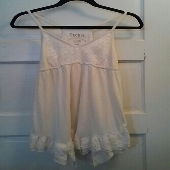 Cream tank top with lace trim.