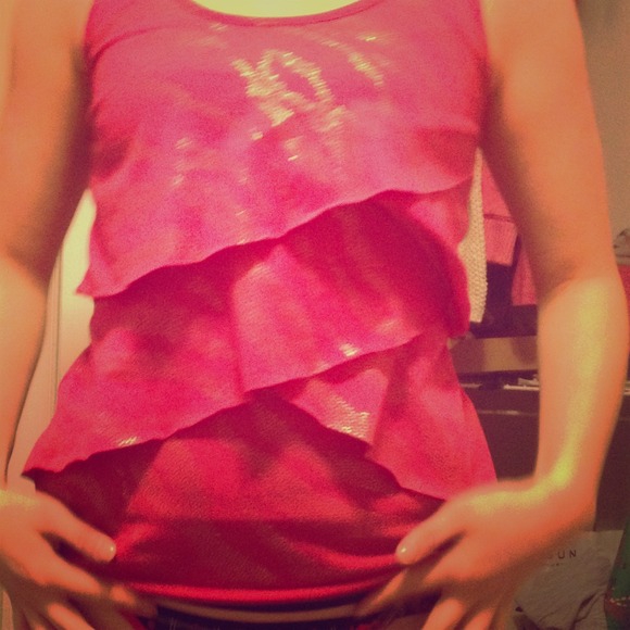 Pink frilly shirt.