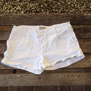 White shorts with cute button detail.