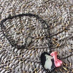 Cute necklace with a white dog.