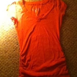 Pink tight crinkle shirt.