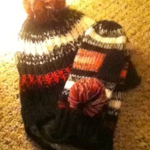 Knitted hat and mittens.