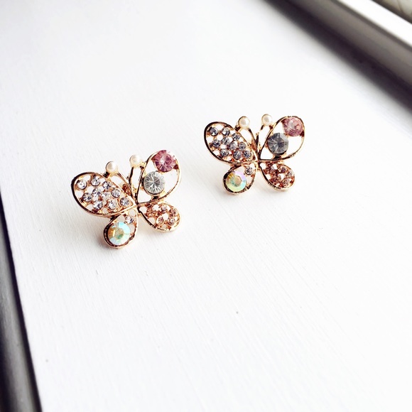Golden butterfly earrings with shiny stone