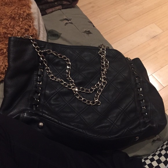 It's a black chain Chanel bag. It's really big. - Picture 2 of 4