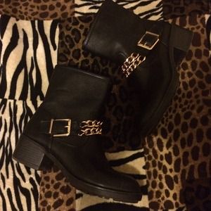 Women's black boots with gold chains