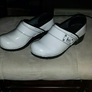 White patent leather nursing clogs