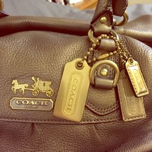 Metallic gold handheld/cross body Coach purse