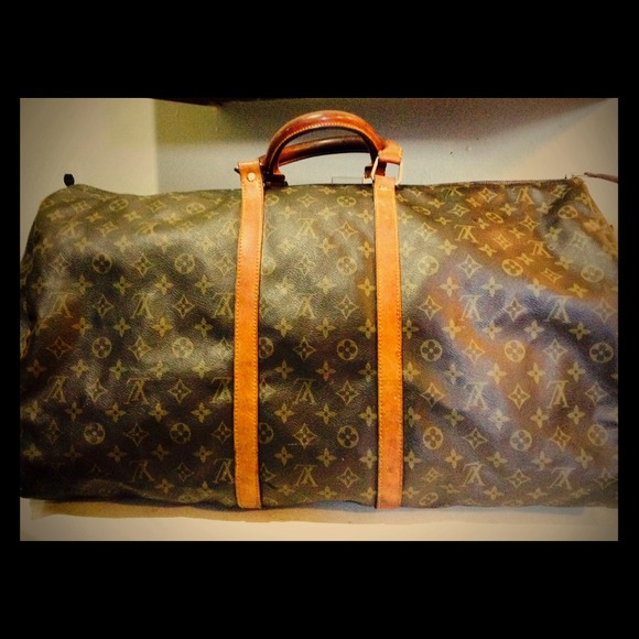 L.V gym/ travel bag. Minor tear and wear.