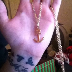 Gold plated anchor necklace.
