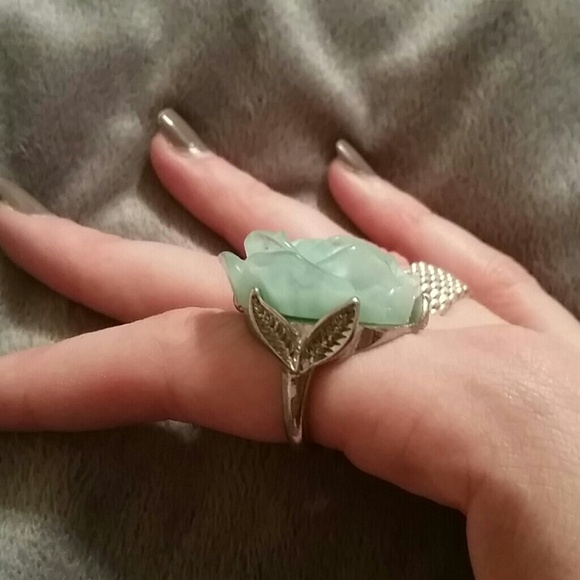 Teal rose ring with silver accent.