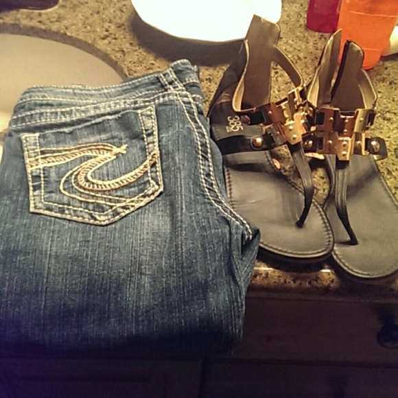 Silver jeans and black and gold sandals