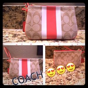 Brand new Orange Coach Wristlet