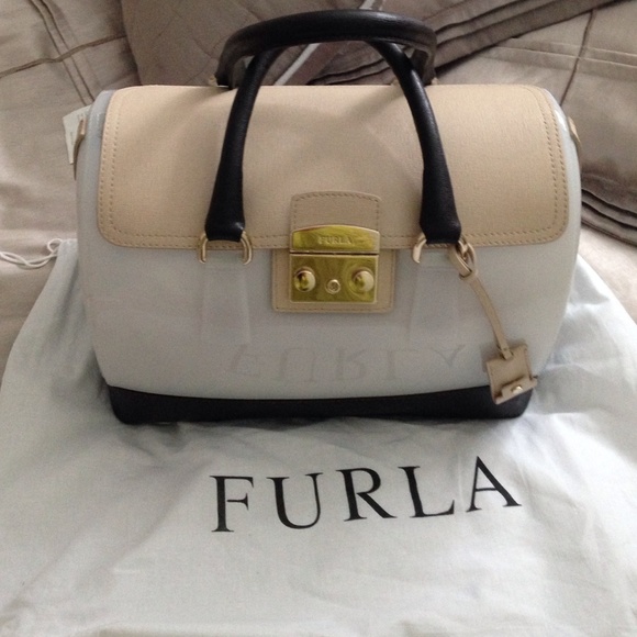 Furla candy bag with leather top and bottom.