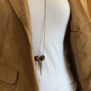 Long necklace with two beads and 3 spikes