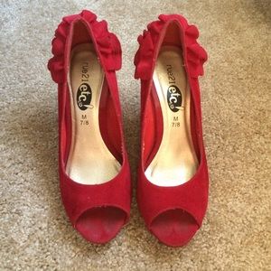 Red heels with ruffles on the back