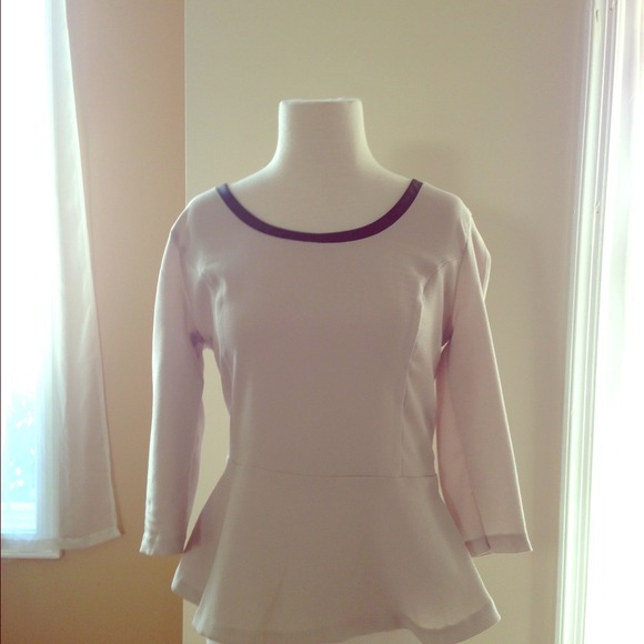 Cream peplum top with faux leather trim. Express