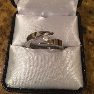 Beautiful size 8 stainless ring with clear stone.