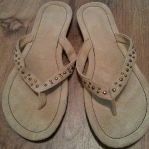 Tan suede flip flops with bronze studs
