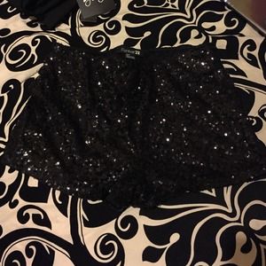 Sequined shorts.