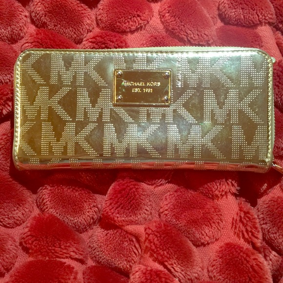 Michael Kors Shiny metallic gold wallet!