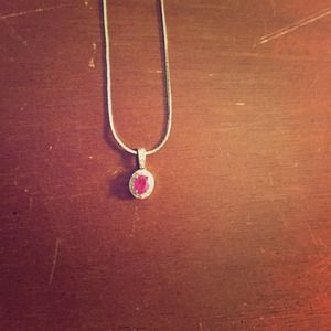 Ruby in the middle with real diamonds around