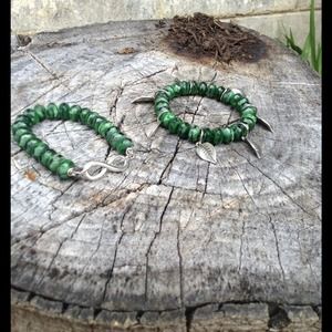 Stretch infinity and leafs tiger's eye bracelet.