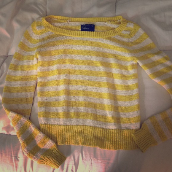 This is a cropped yellow and white sweater