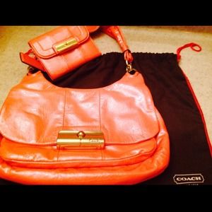 Authentic NWT Coach purse with matching wallet.