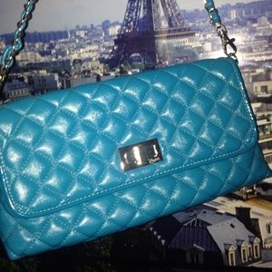 Blue quilted-style turn lock chain purse