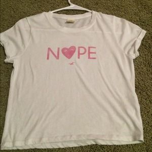 A pink and white Hollister t-shirt