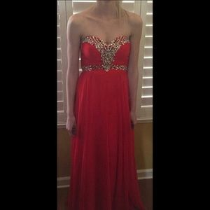 Red bejeweled prom dress
