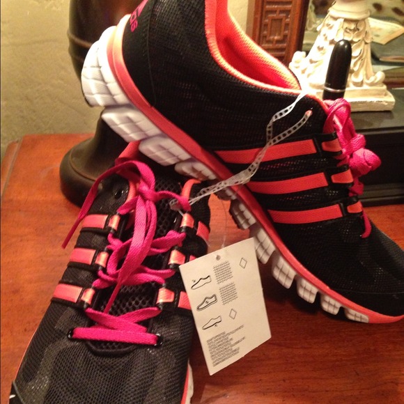 Black and neon pink running shoes