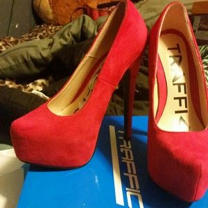 Red suede pumps