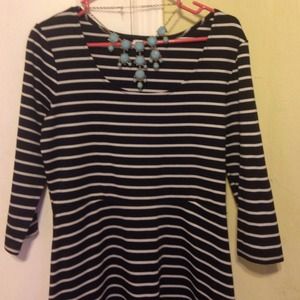 Black with white stripes dress .