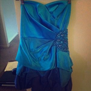 Formal knee length strapless dress.