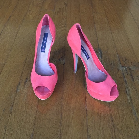 Peep too pumps with a little platform toe