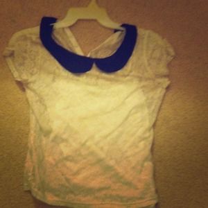 Collared white lace shirt.