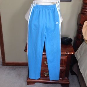 Light blue with white trim Adidas sweats.