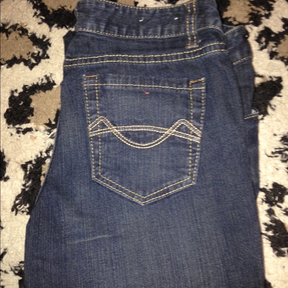 Never worn, dark jeans.