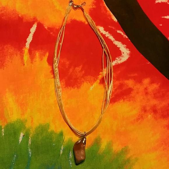 Rock pendant necklace.