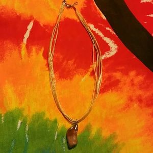 Rock pendant necklace.