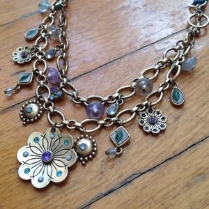 Golden flower necklace on leather purple turquoise