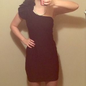 Black form-fitting one shoulder dress